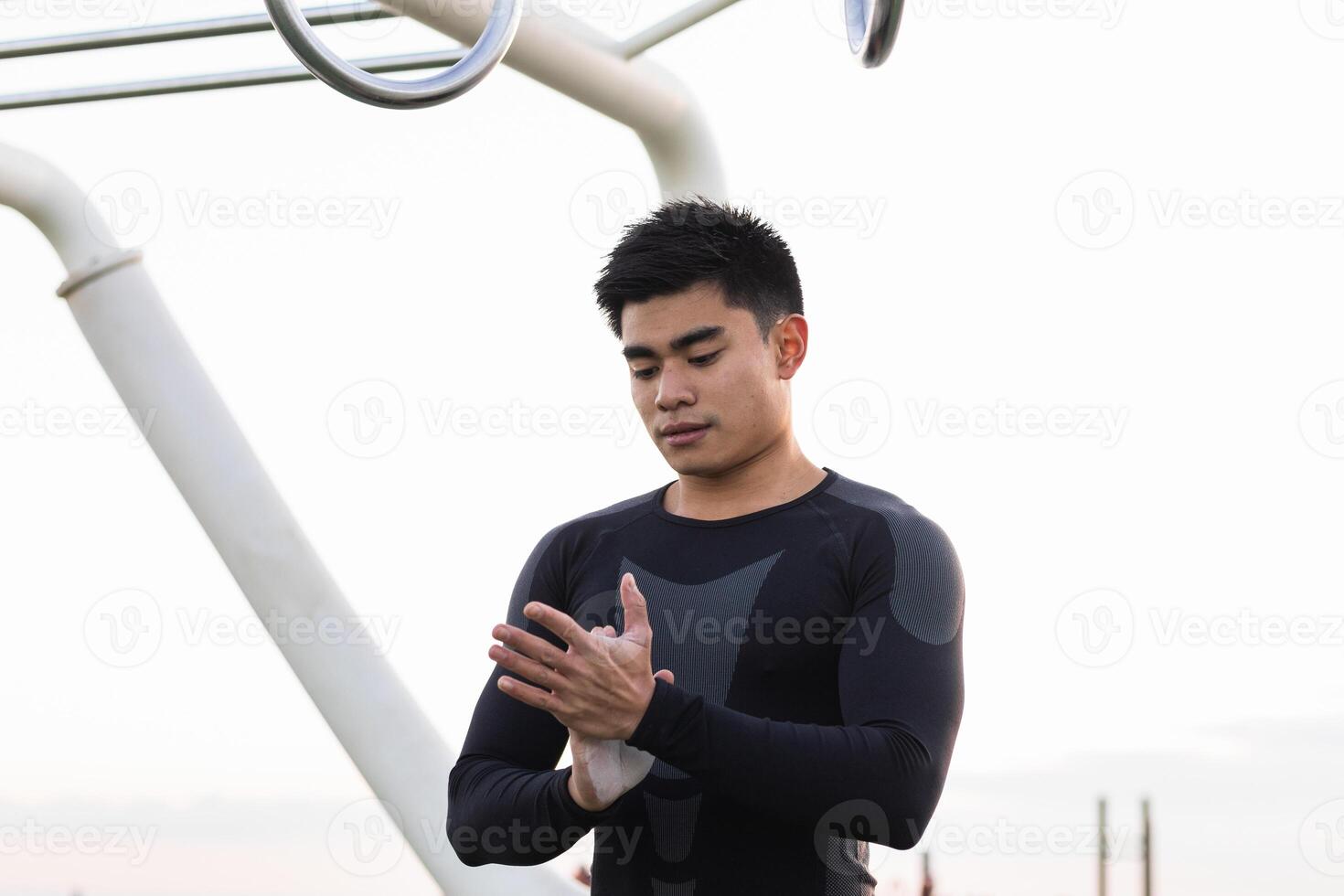 Athletic man with powdered hands photo
