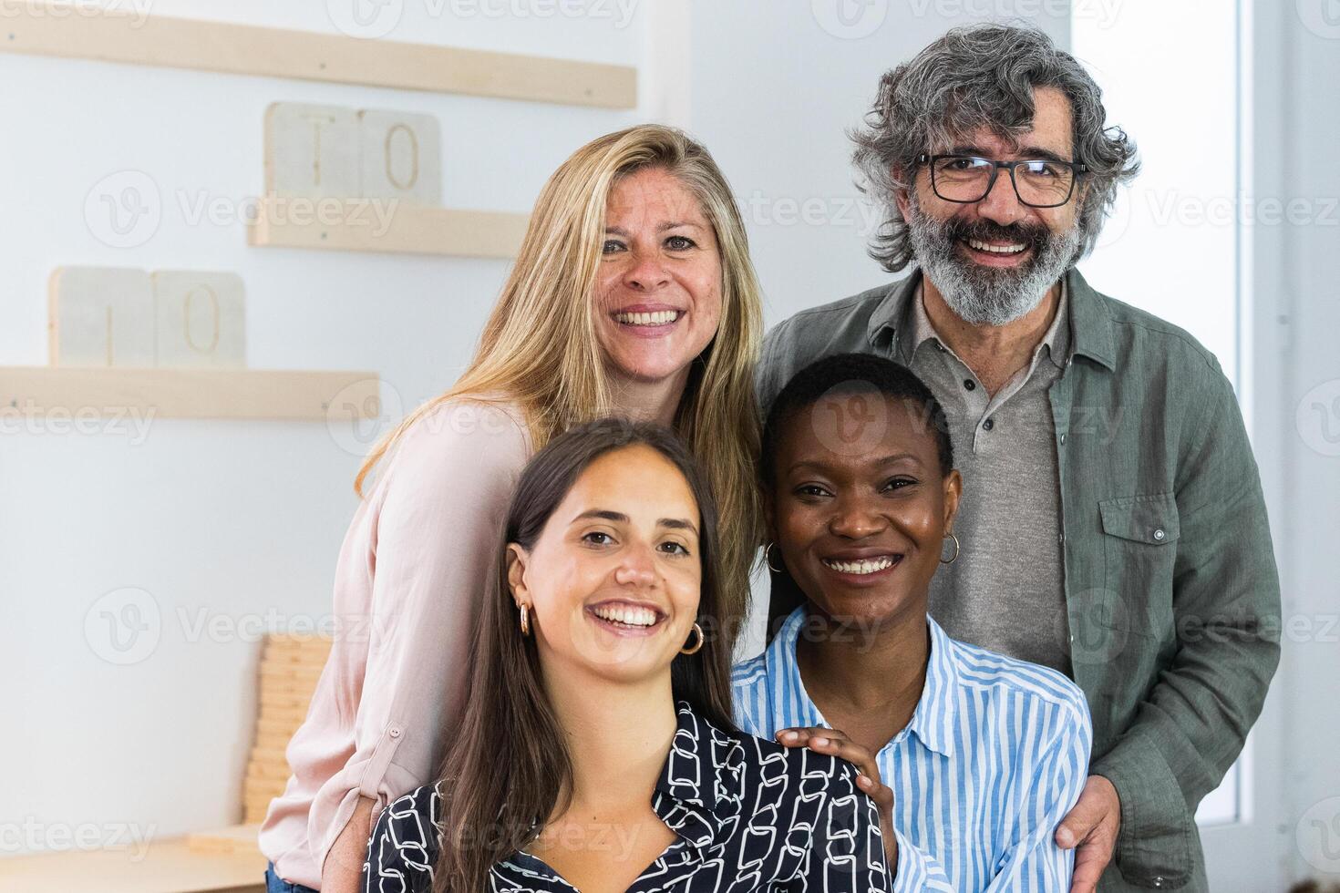 Cheerful diverse coworking women looking at camera photo