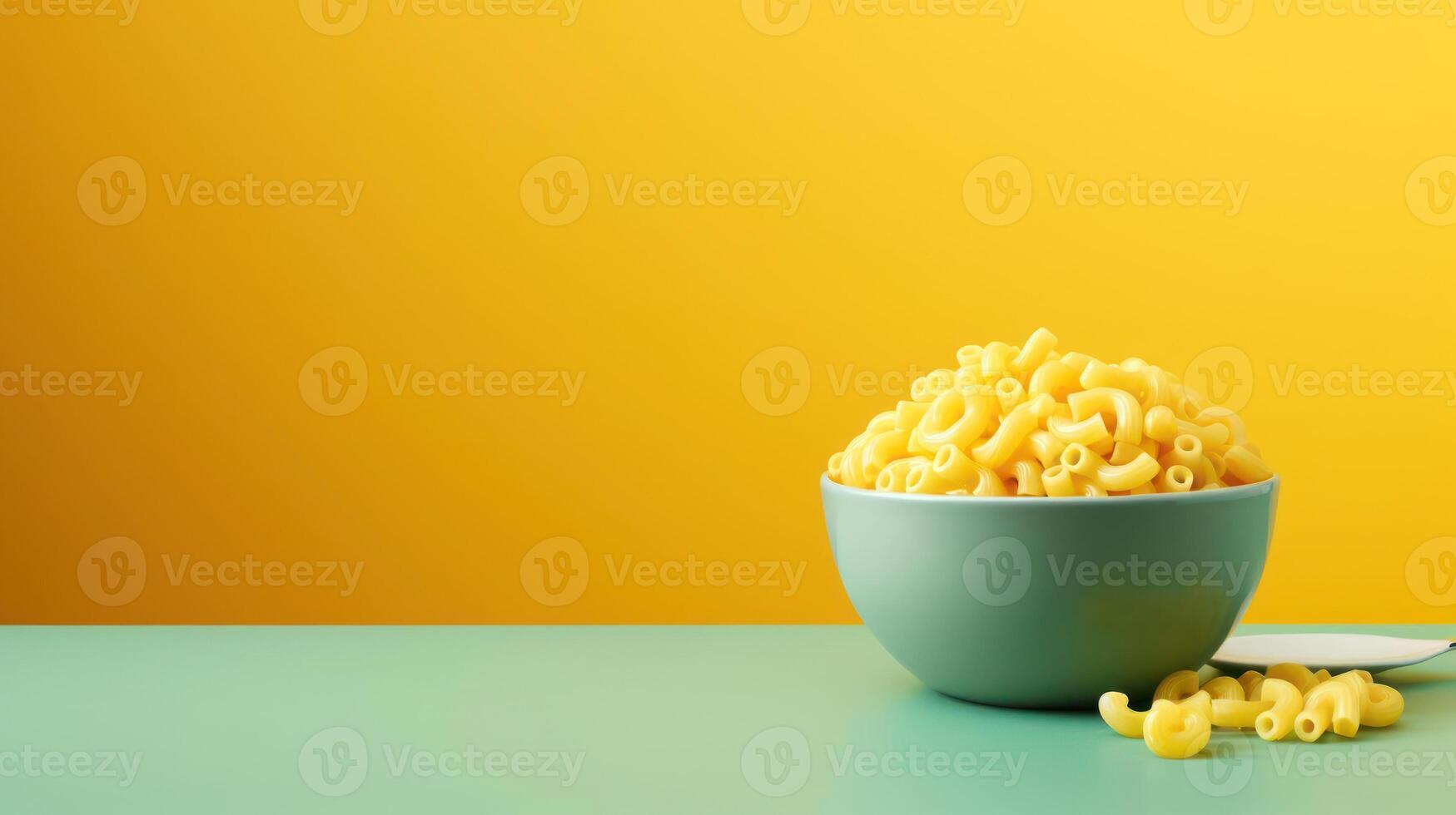 A bowl of macaroni with a spoon on the side photo