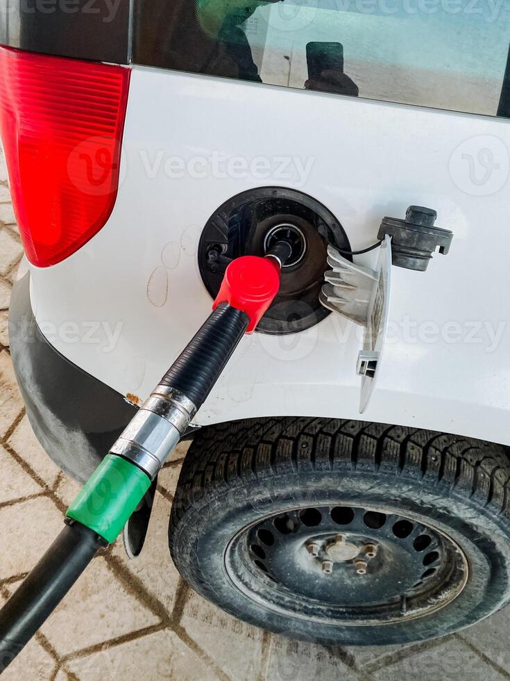 Refueling a Vehicles Gas Tank at a Service Station Fuel Pumping in Action, a Common Activity for Drivers on the Go, Ensuring Convenient Access to Energy for Transportation Needs photo