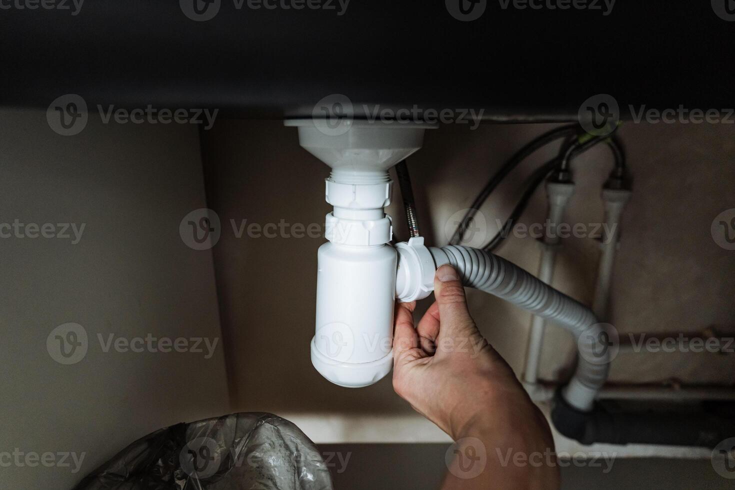 This guide details Hand Repairing Kitchen Sink Plumbing, providing a stepbystep method to fix a clogged drain pipe under the sink for better home maintenance photo