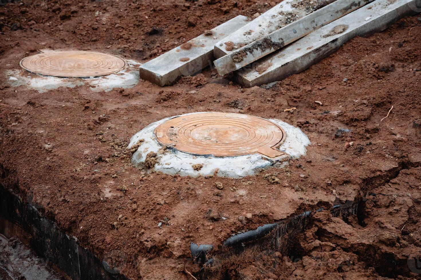 A substantial pile of concrete blocks is currently resting on top of a sizable mound of dirt that consists of various particles and materials, including soil, sand, and mud photo