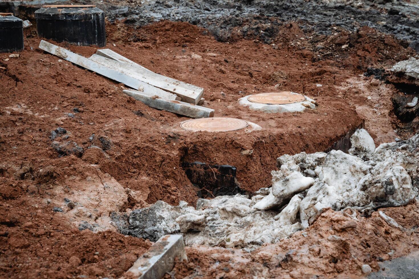On a construction site, there is a significant accumulation of dirt and rocks that have been gathered and piled up, showcasing the geological phenomenon of soil excavation and geology photo
