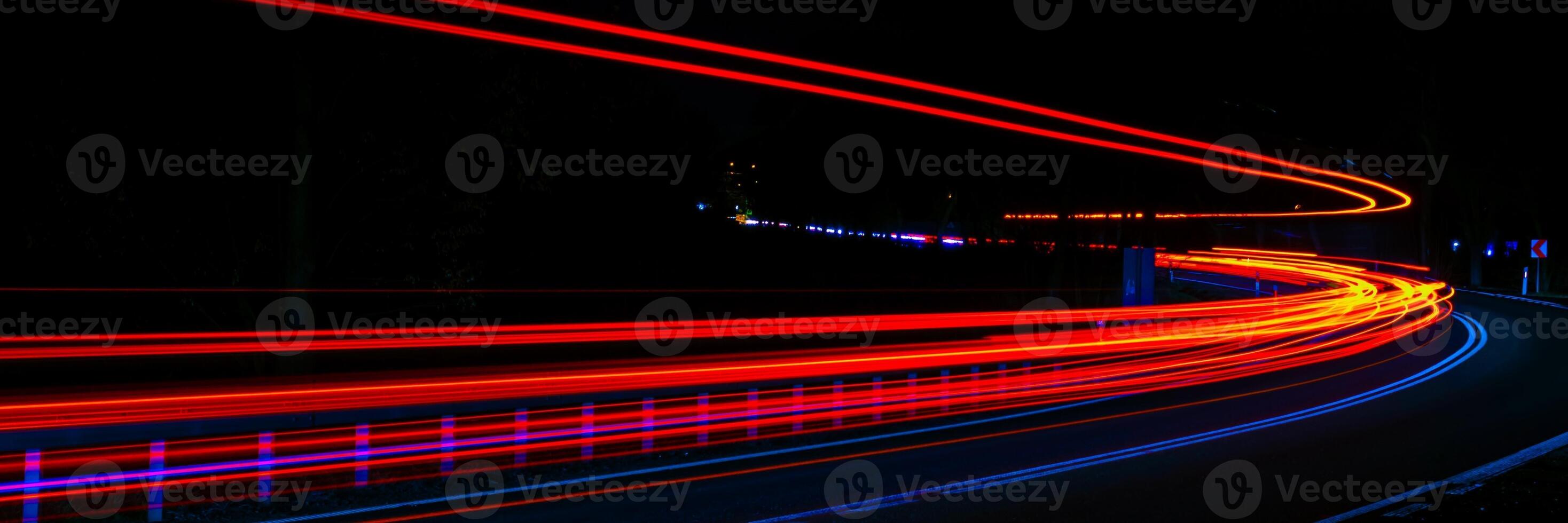 red lights of moving cars at night. long exposure photo