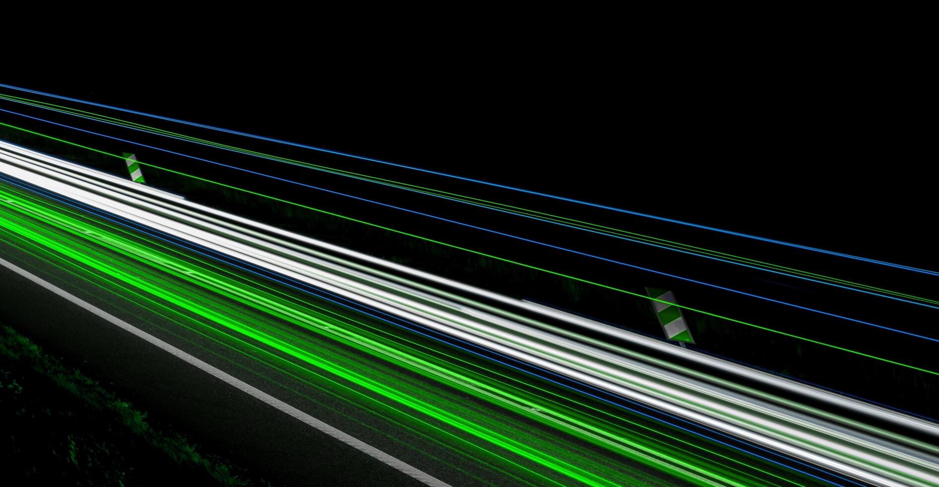 green car lights at night photo