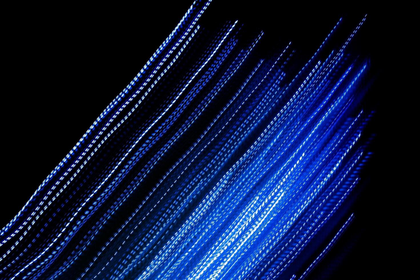 blue dashed lines of lights on a black background photo