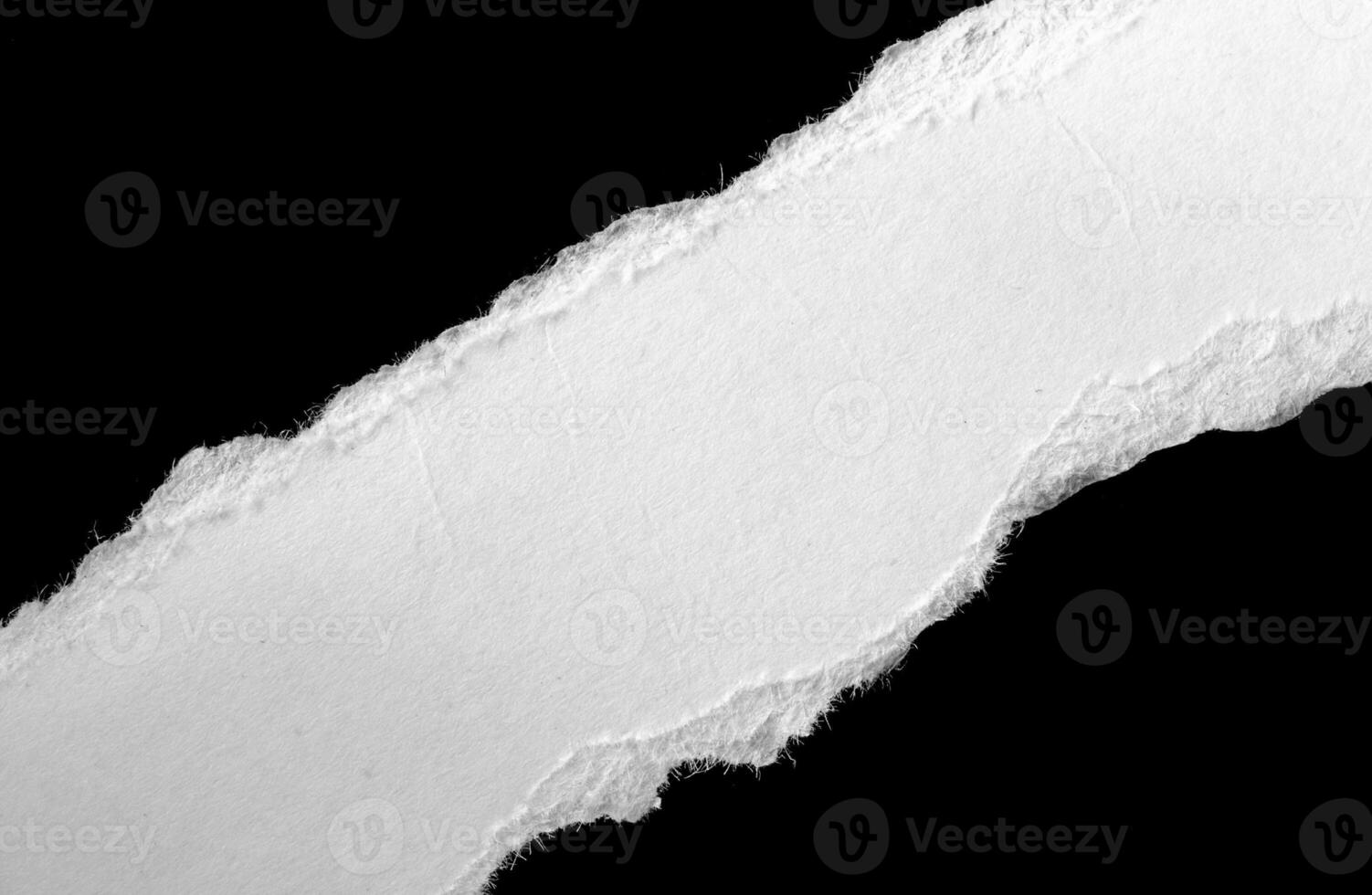 a white piece of paper on a black background photo