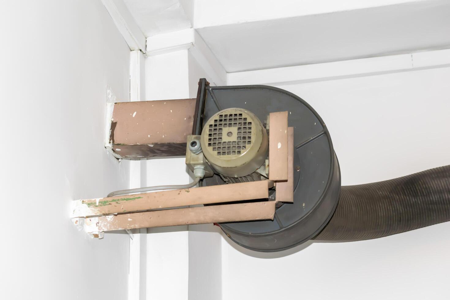 old air blower on the background of a white wall photo