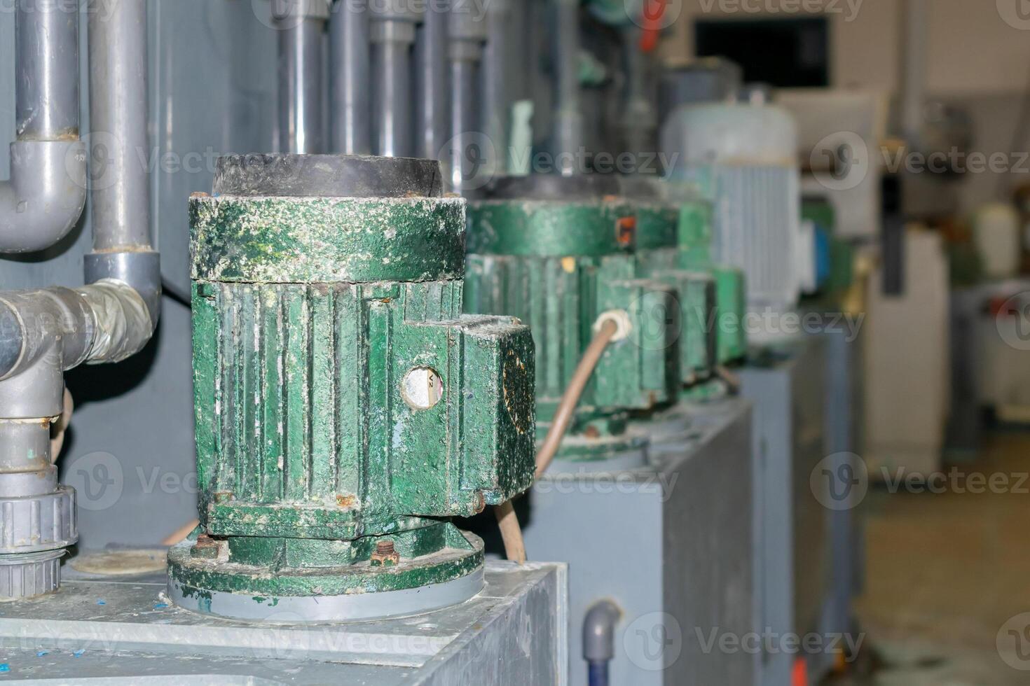 old electric motors powering machines in industry. photo