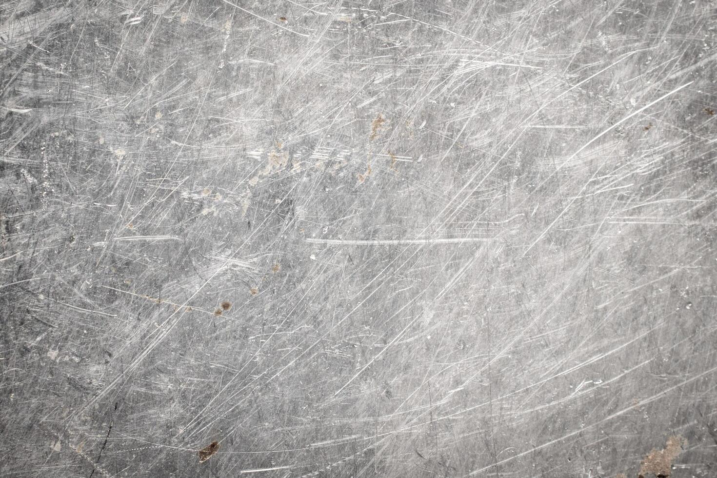 scratched metal sheet with visible texture. background photo