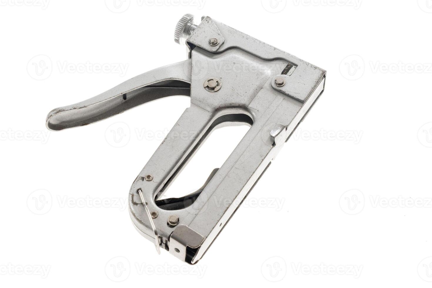 foil construction stapler isolated background photo