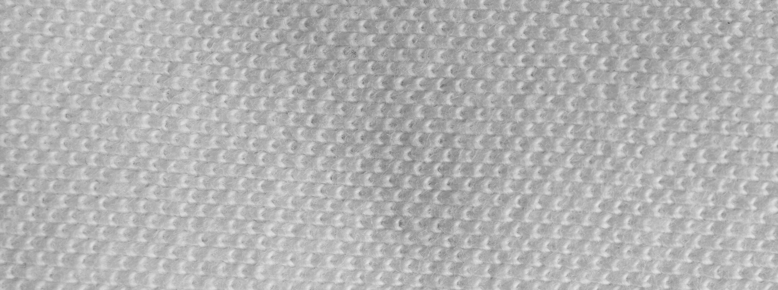 white cotton material with a visible texture. background photo