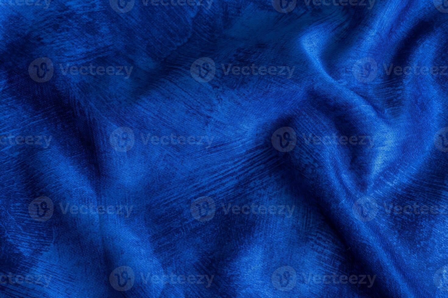 crinkled blue cotton fabric with visible texture photo