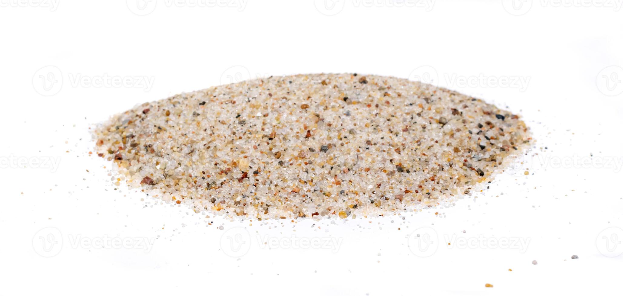 grains of sand on the white isolated background photo