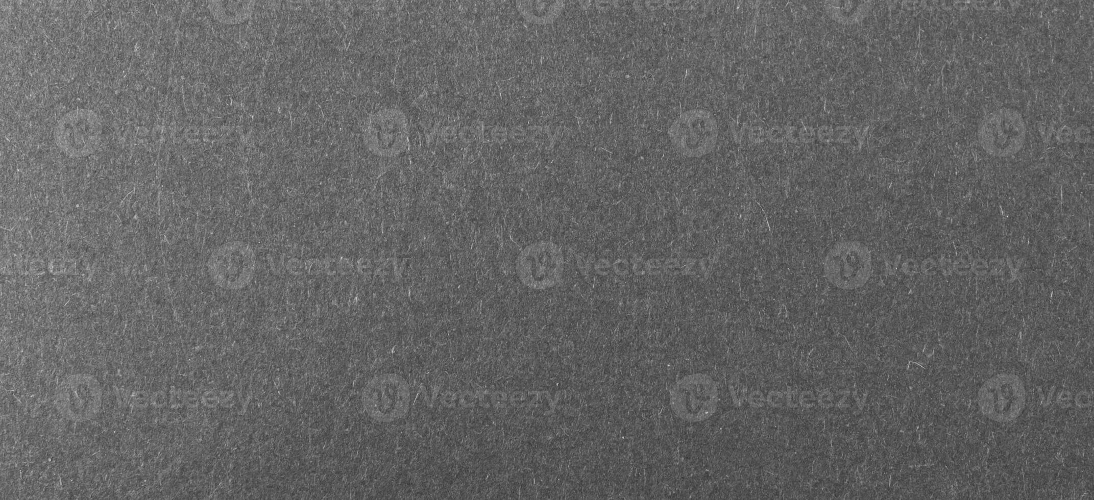 black sheet of paper with a visible texture photo