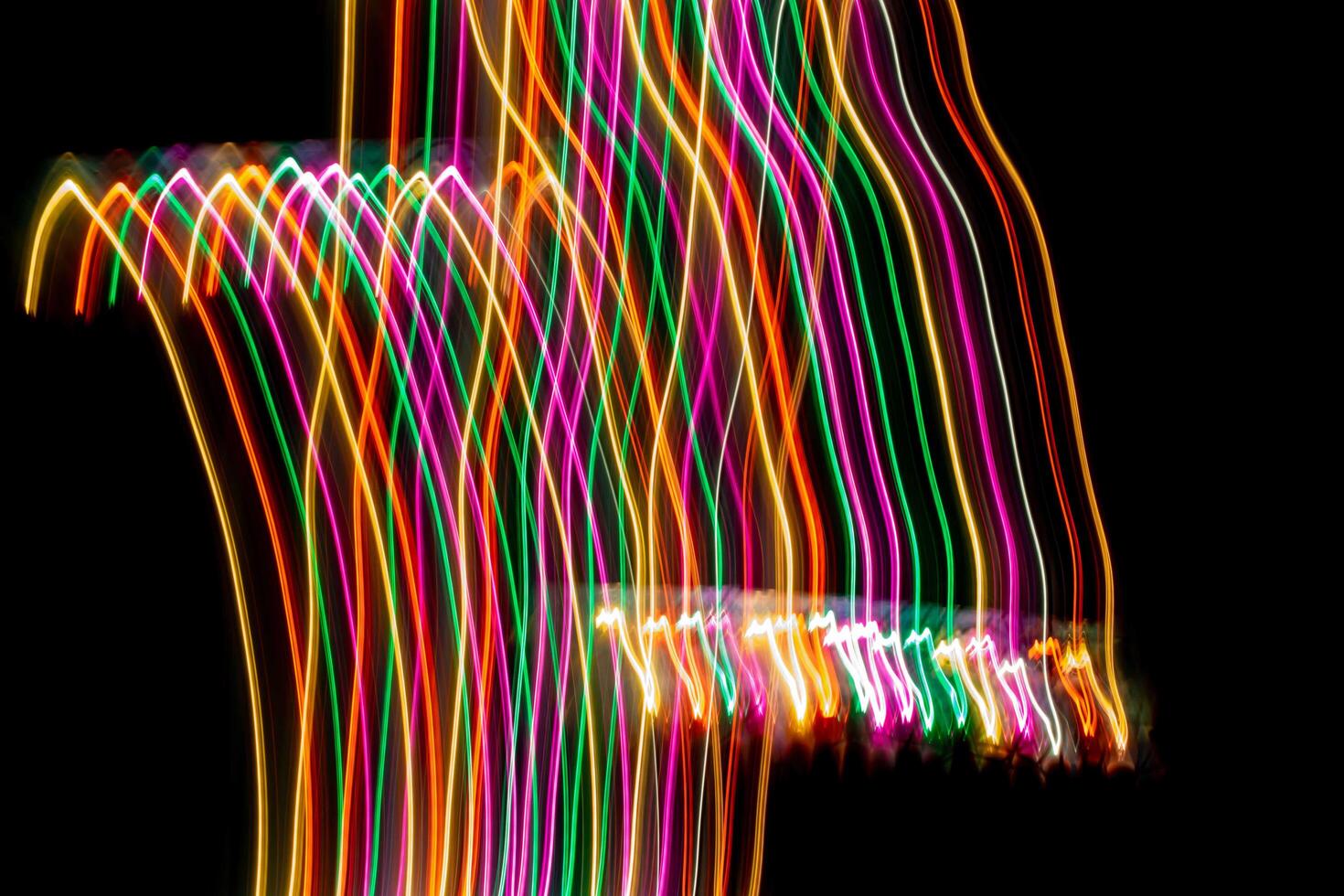 colorful luminous lines on a black background photo