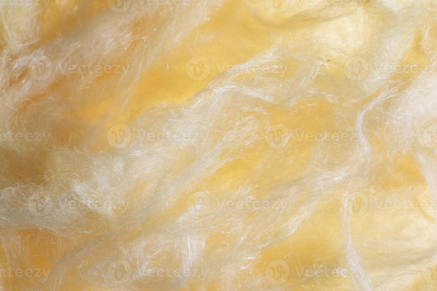 yellow mineral wool with a visible texture. photo