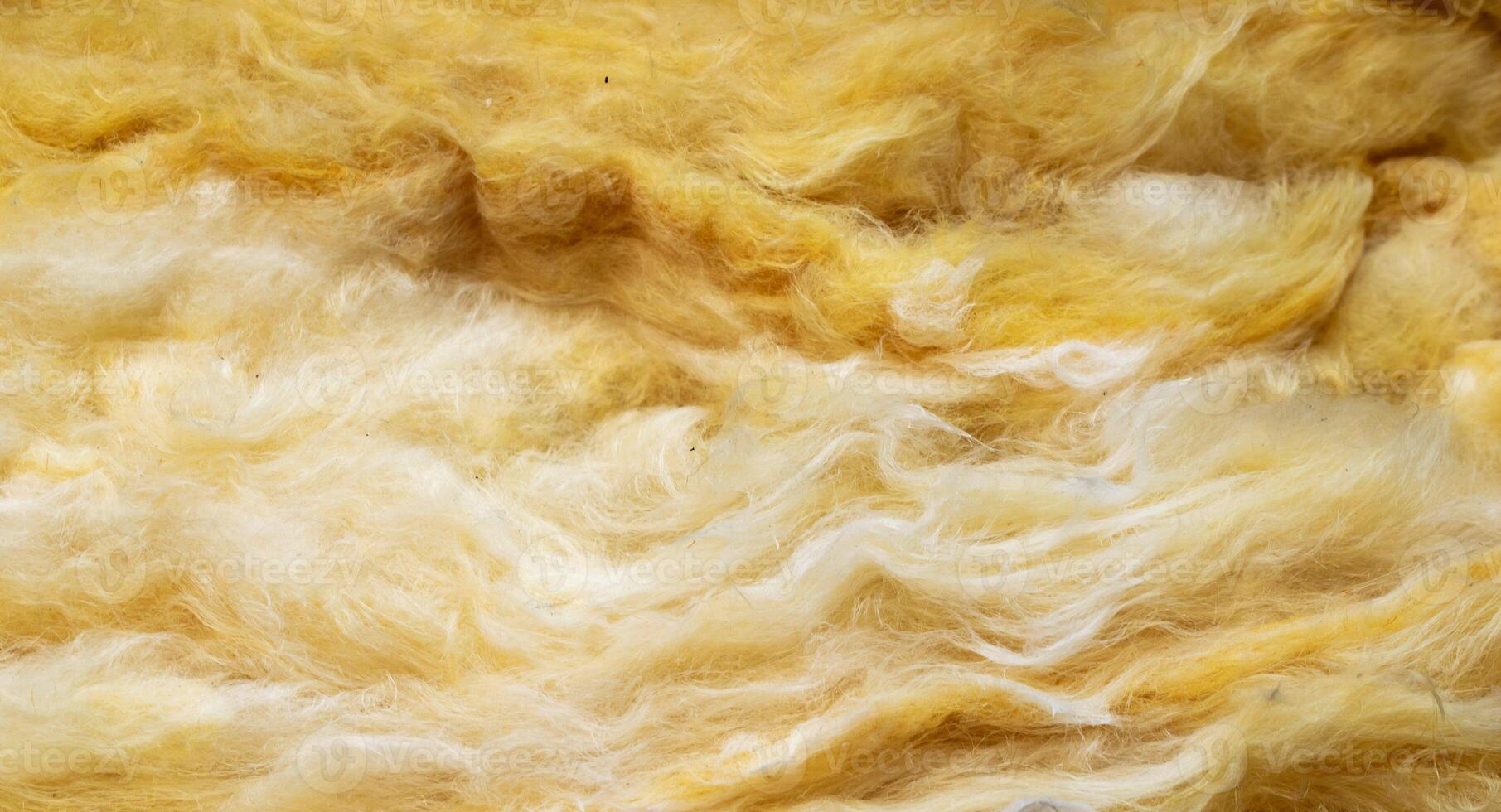 yellow mineral wool with a visible texture. background. photo