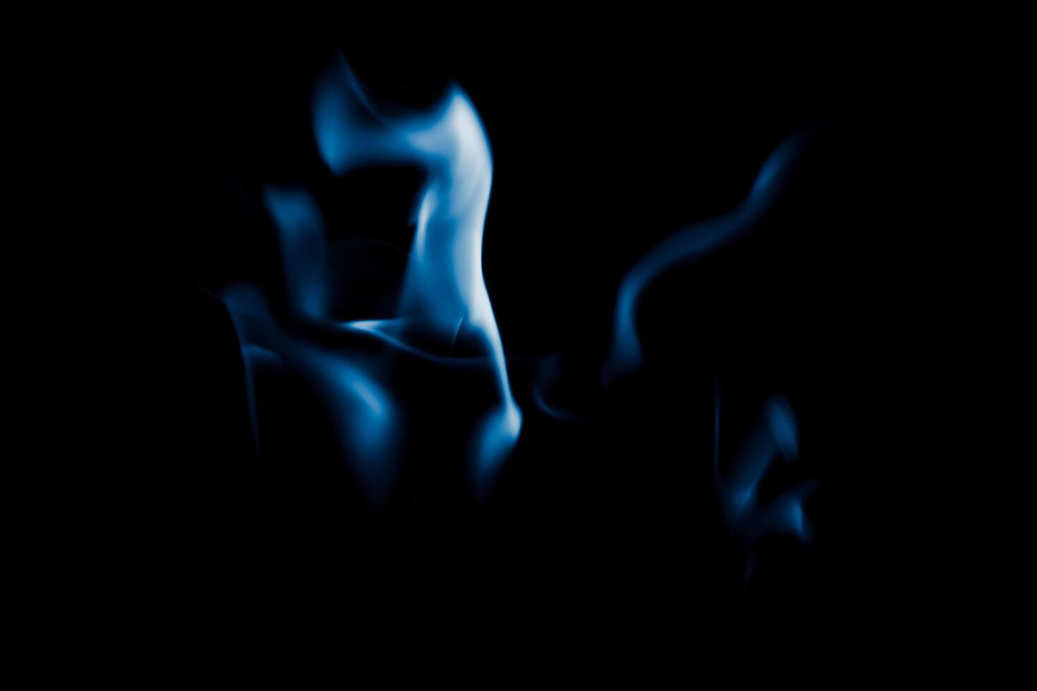 fire blue flames on black isolated background. photo