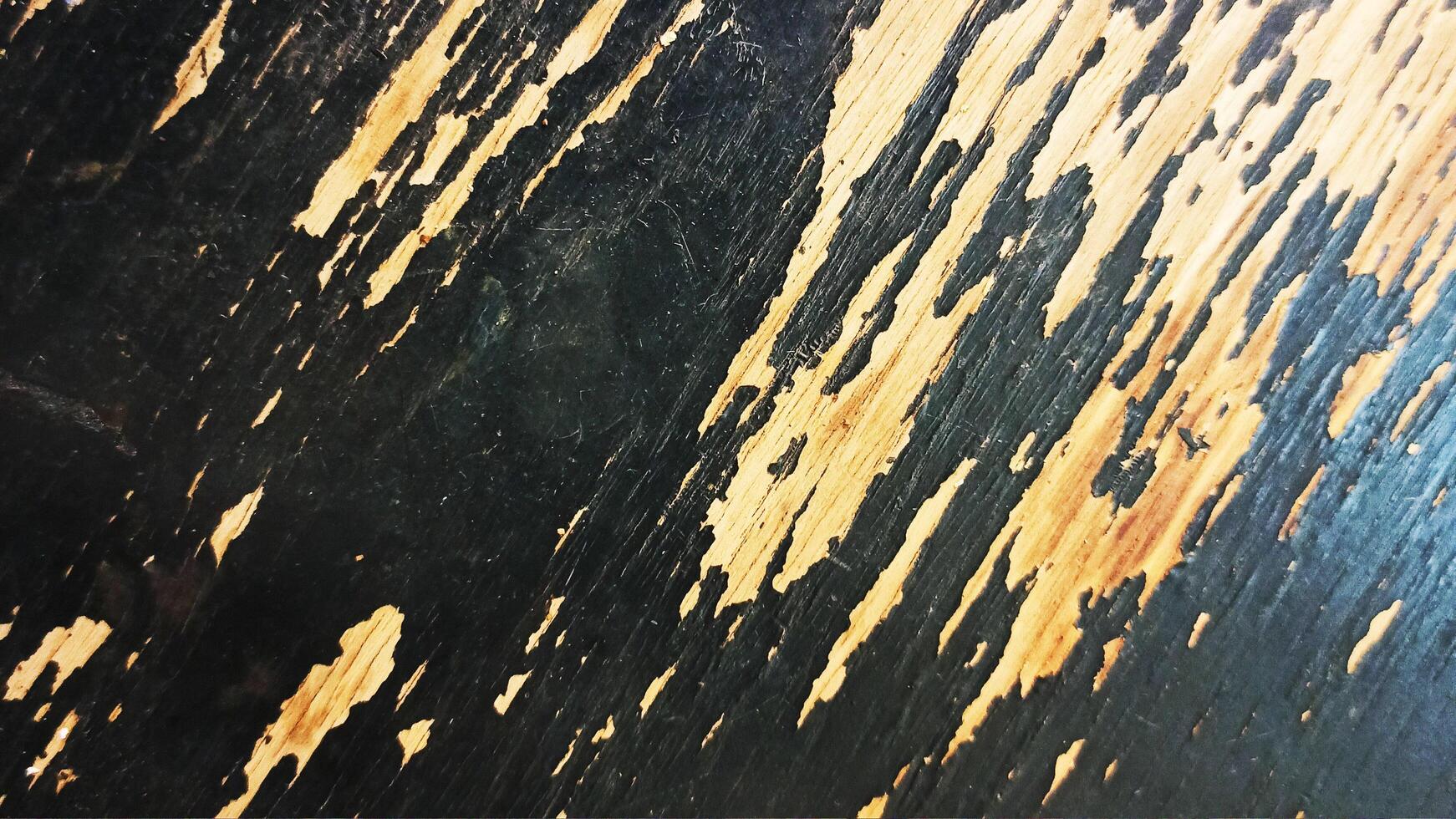 old board painted with black paint. background photo