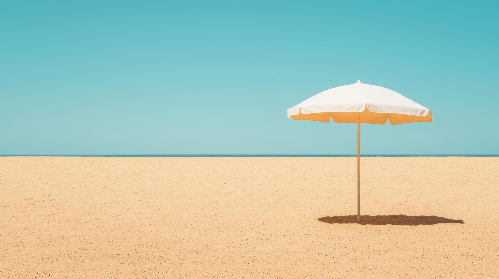 Solitary beach umbrella against a tranquil ocean background coastal landscape minimalist view photo