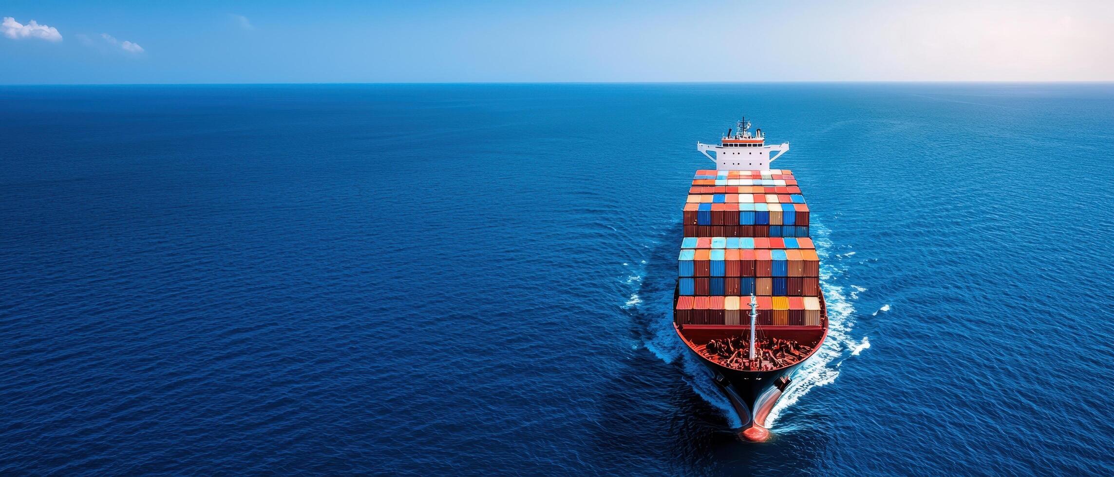Cargo ship navigating open waters ocean background nature elements aerial view maritime concept photo