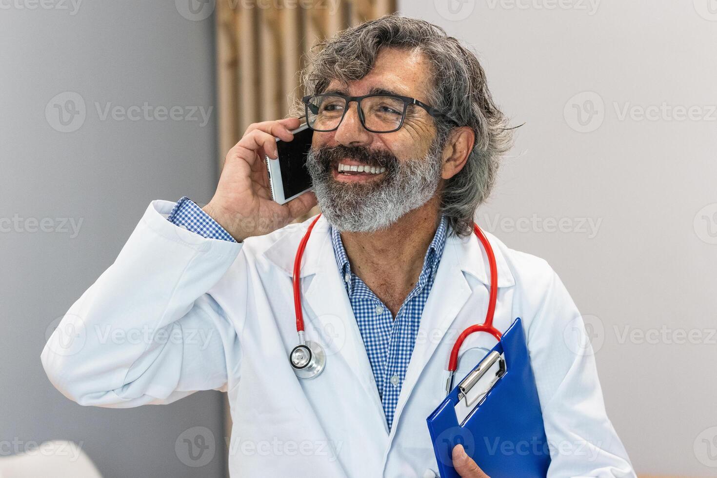 Senior doctor using smartphone in medical office photo