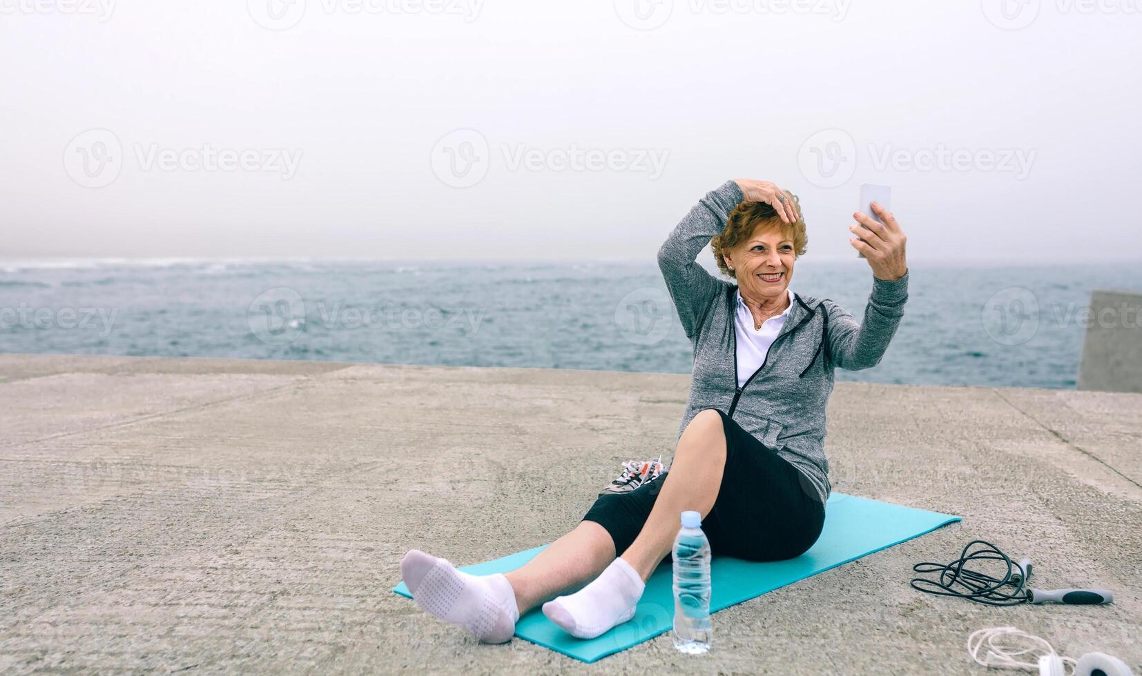 Senior sportswoman taking selfie photo