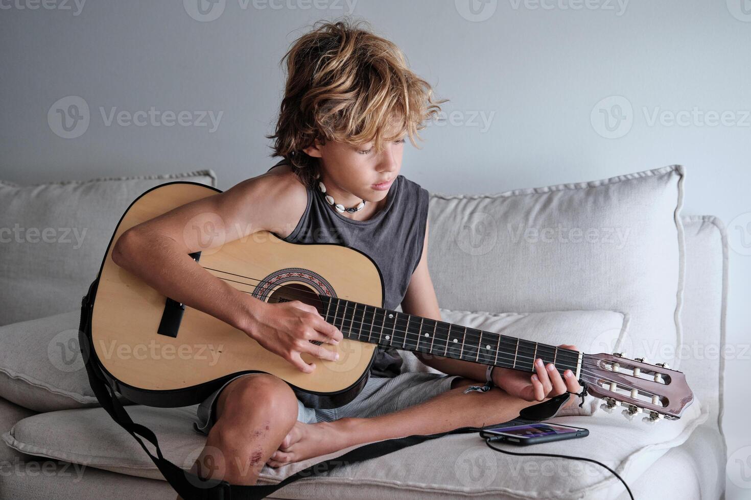 Child playing the guitar photo