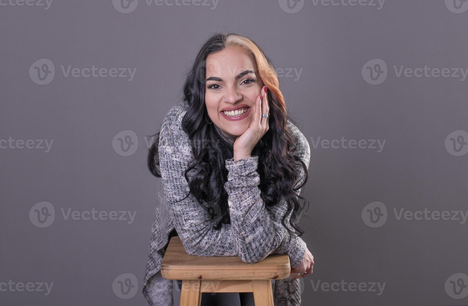 Beautiful woman looking at camera with hands on face. photo