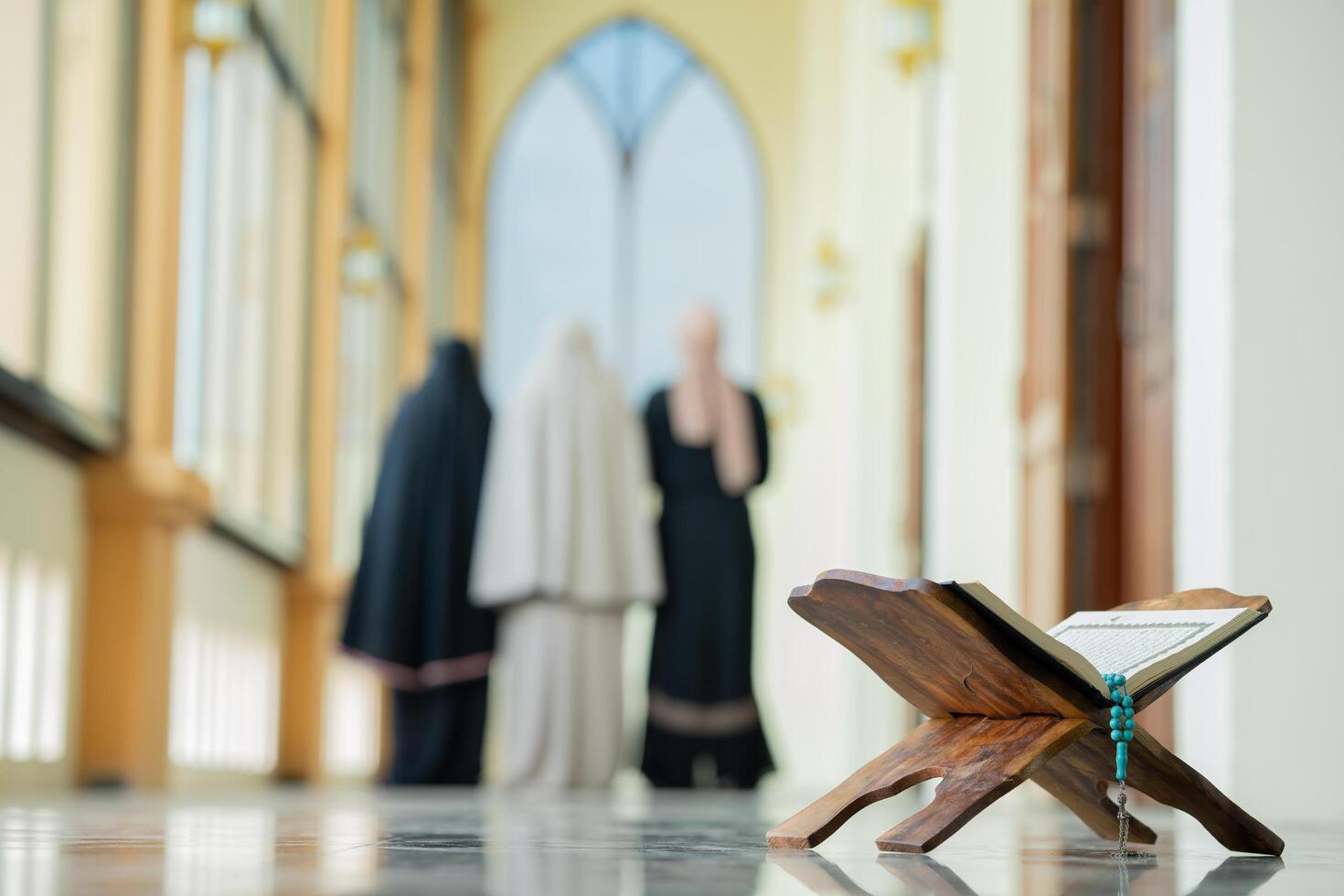 Many groups of Asian Muslim women in the Islamic religion in hijabs She was praying in a beautiful mosque out of respect for God. photo