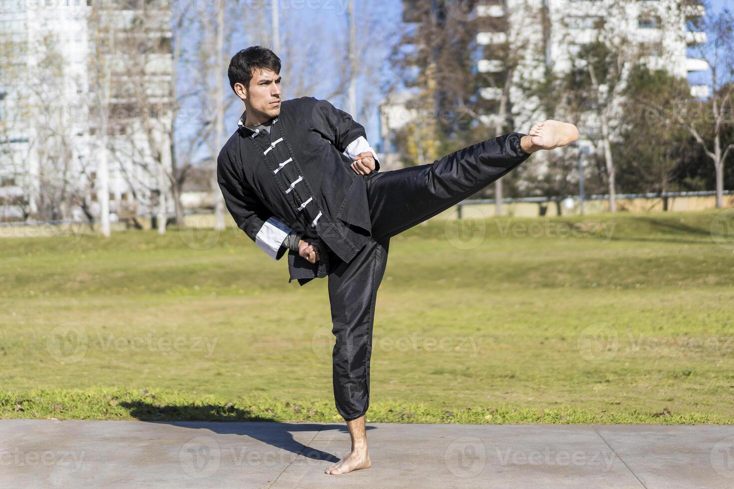 A man doing a kick in the air photo