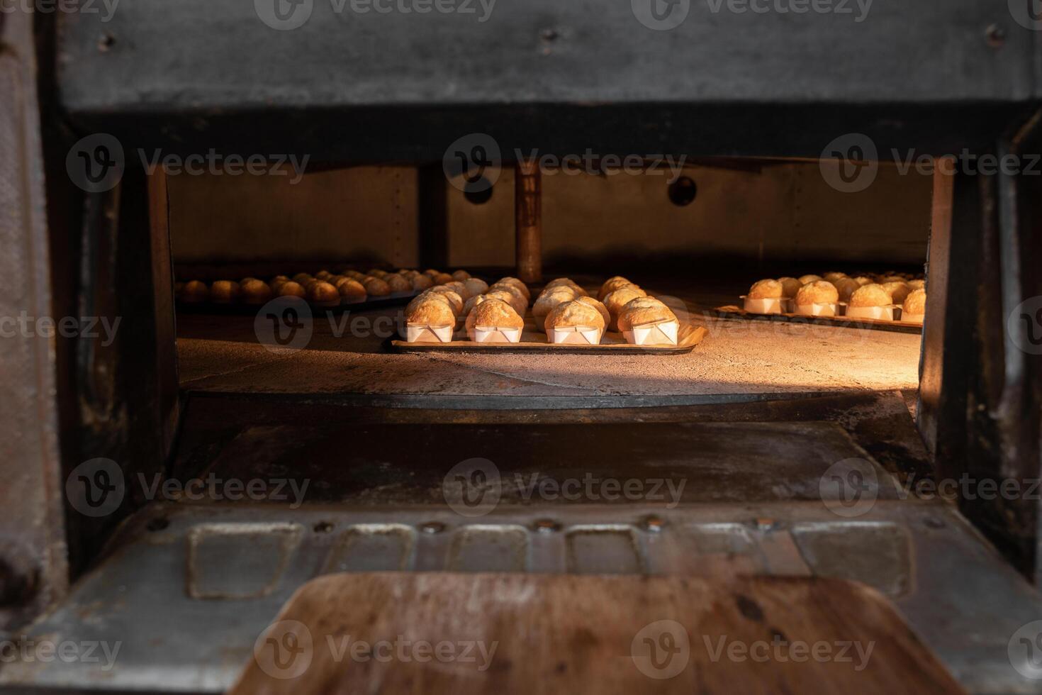 A large oven with a tray of bread photo
