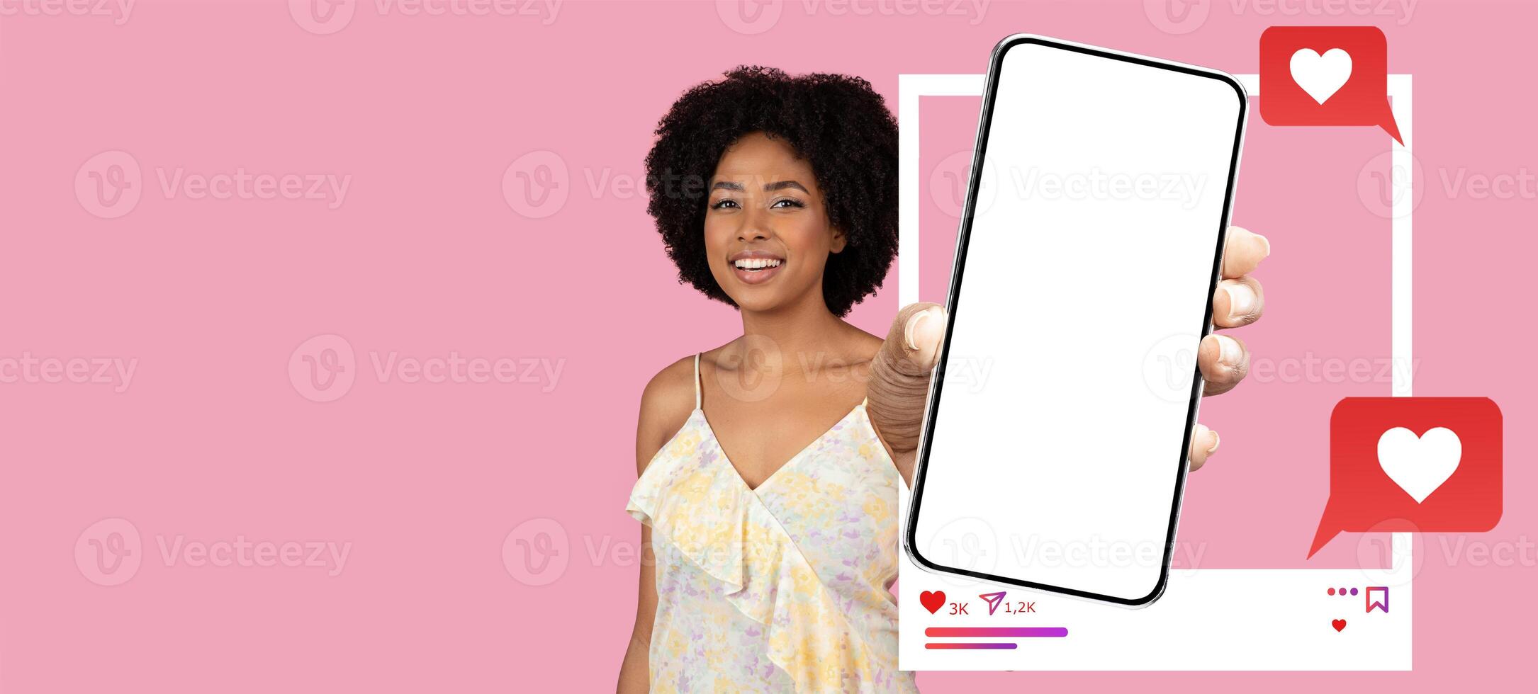 An influencer is holding a smartphone, displaying a blank screen, against a vibrant pink background. She is excitedly engaging with her online audience, emphasizing social media interaction. photo