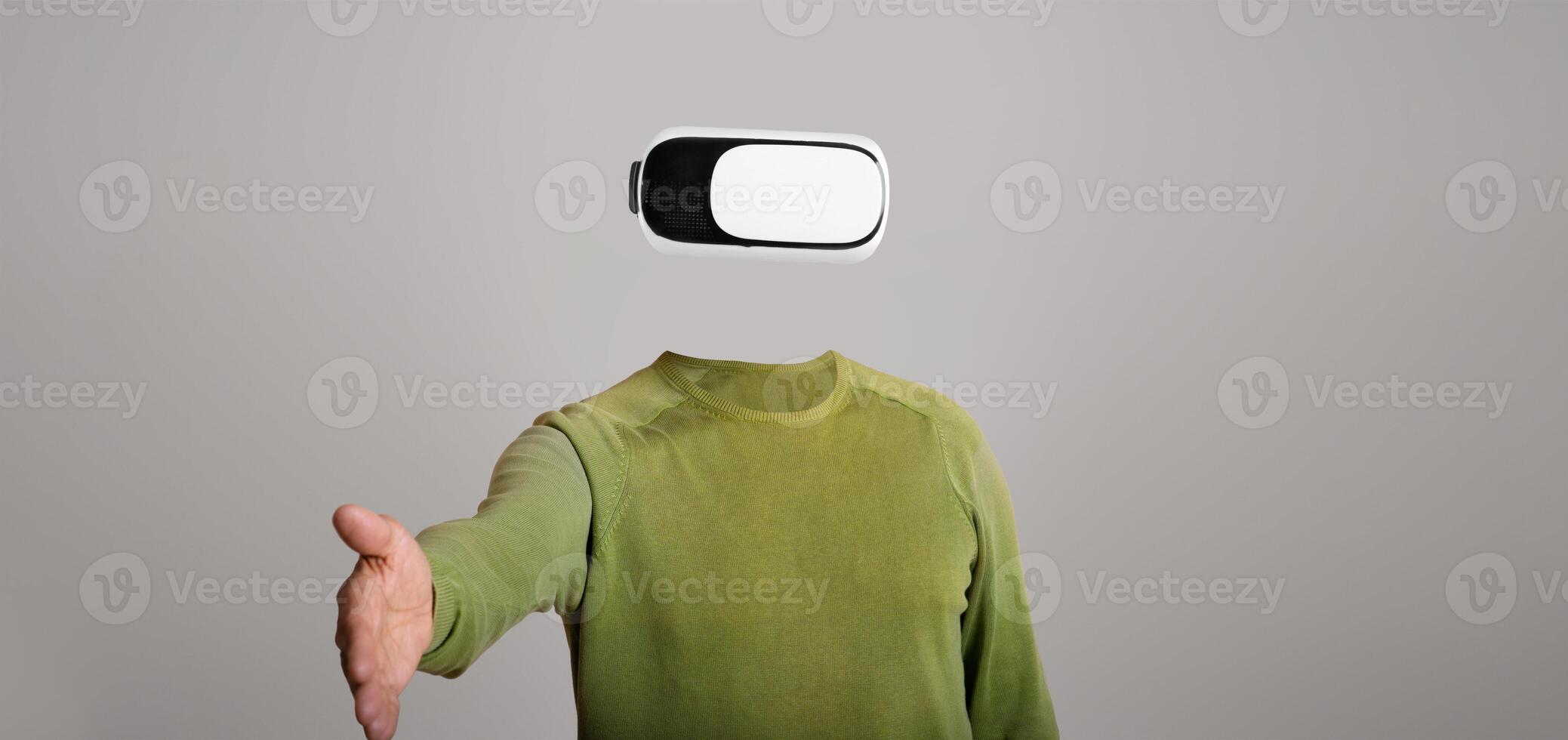 A user wearing a modern virtual reality headset, with no visible head or face, reaches out as if inviting interaction. The minimalist background emphasizes the advanced gadget's features. photo