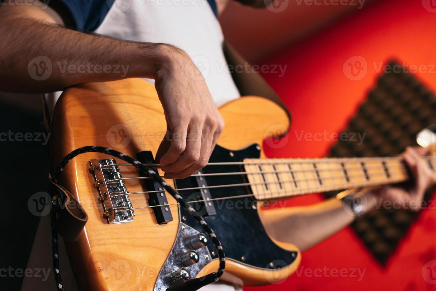 Close-up of a musician playing bass photo