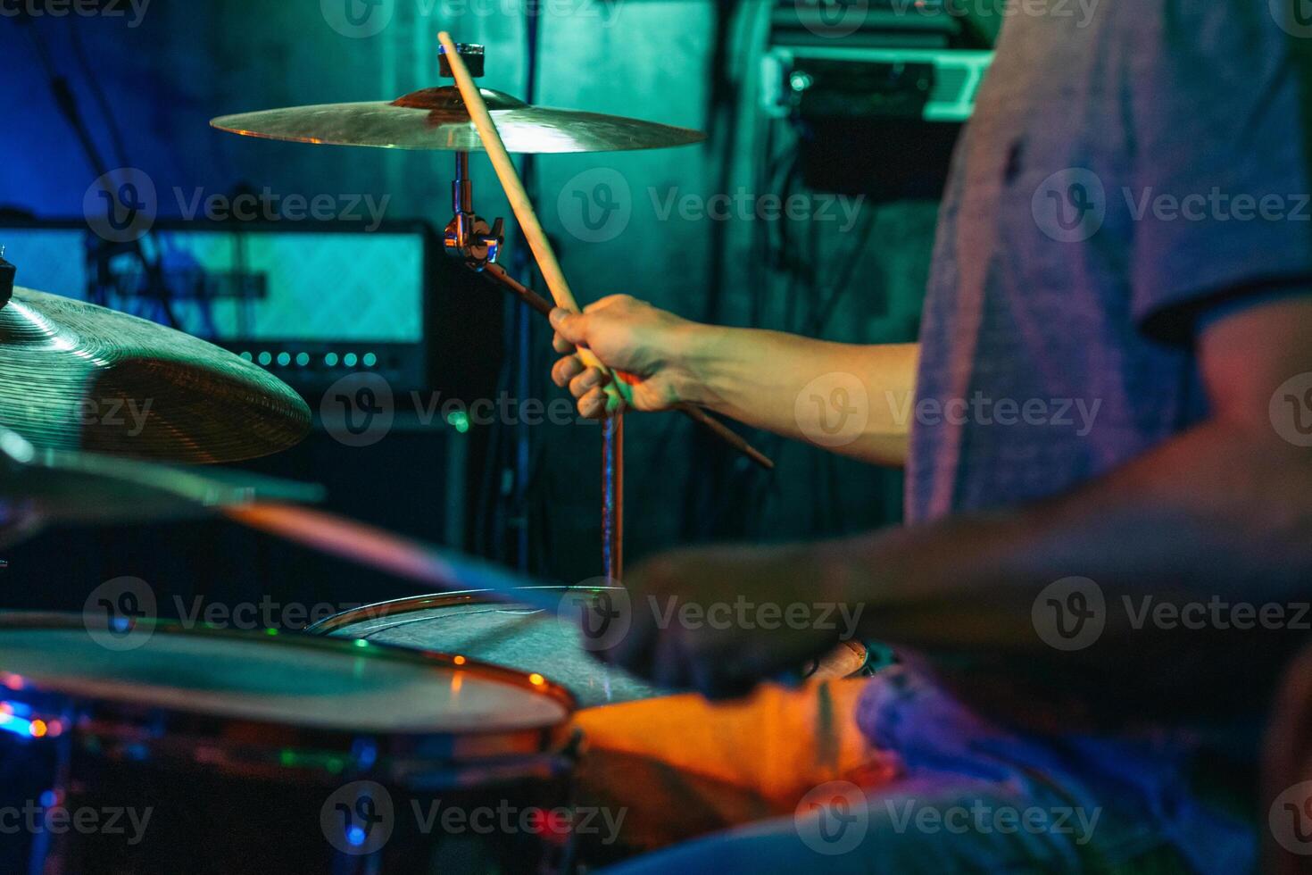 Drummer In Stage With Colorful Lights photo