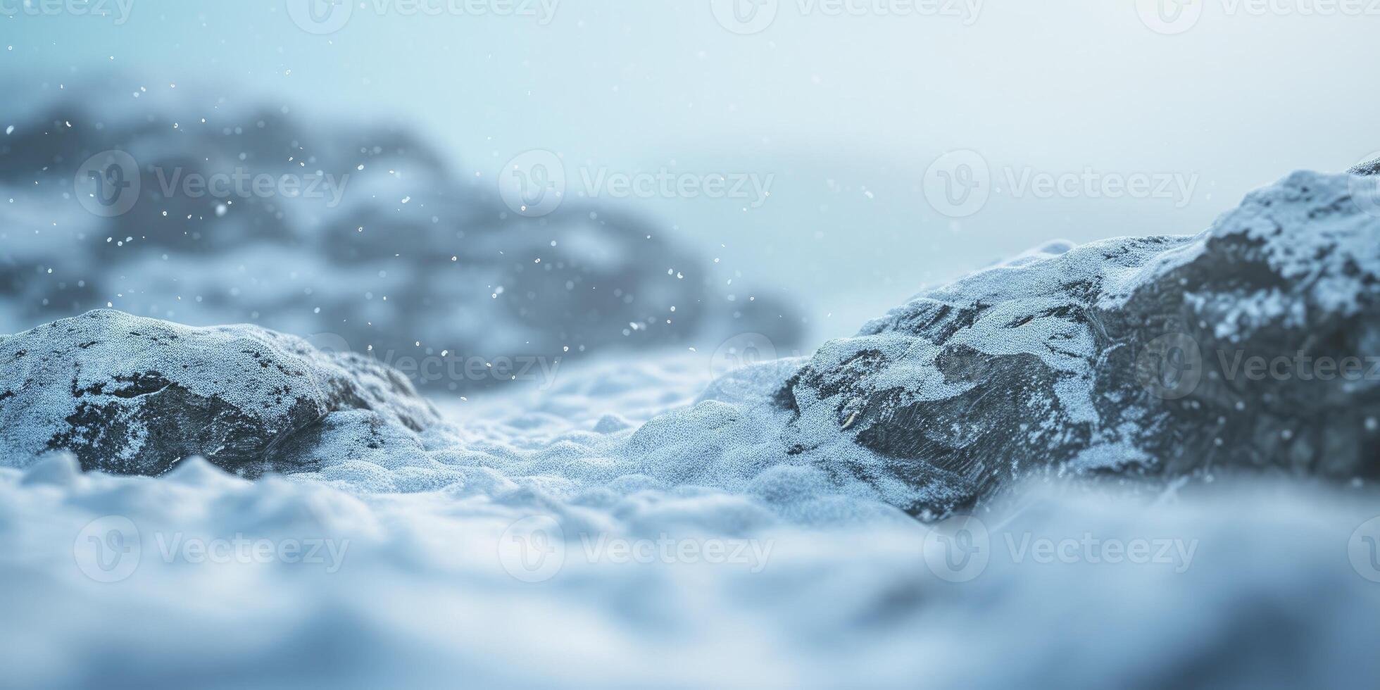 A snowy mountain scene with rocks and snow photo