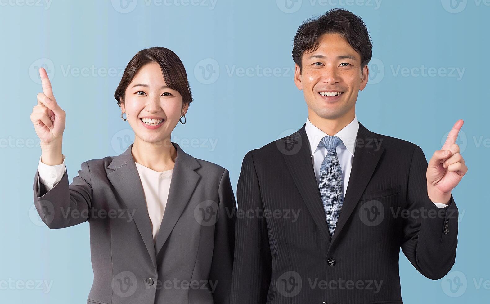 Business colleagues pointing upwards photo