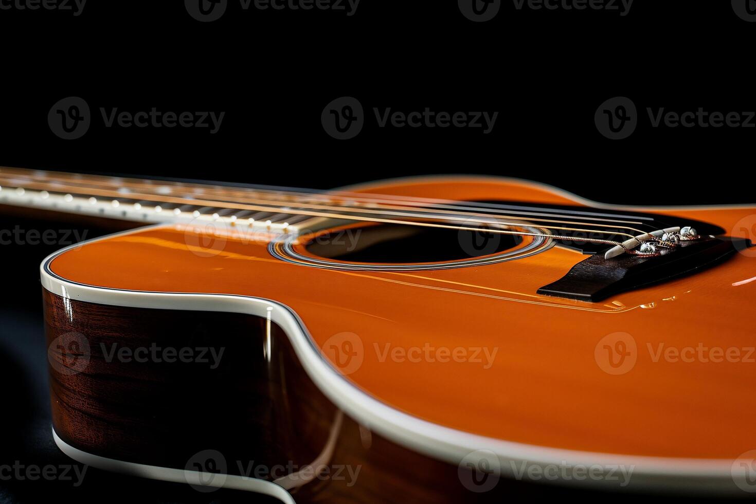 Close-up of an orange acoustic guitar photo