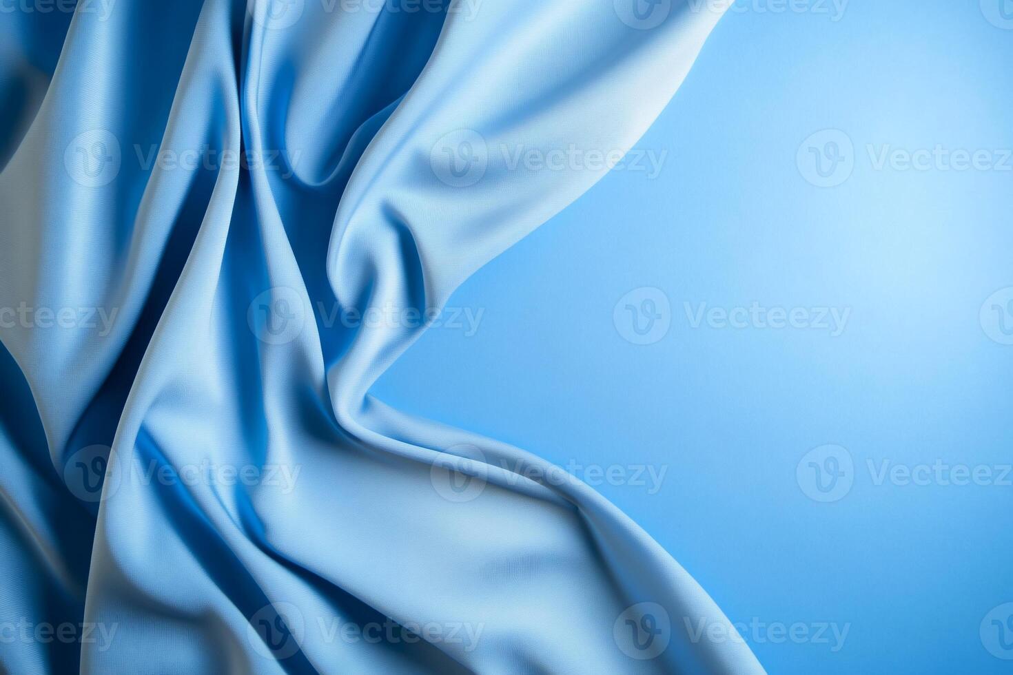Blue silk fabric on a blue background photo