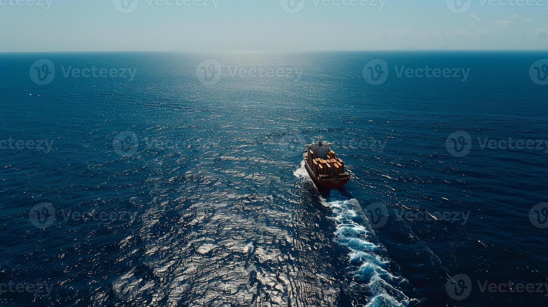 A boat traveling across the ocean in the middle of the day photo