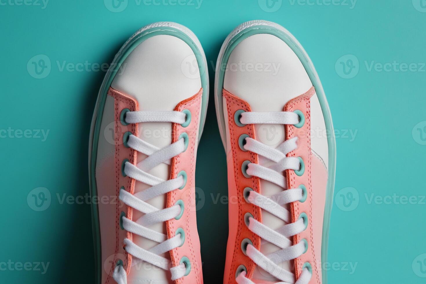 Top view of sneakers with white laces on a blue background photo