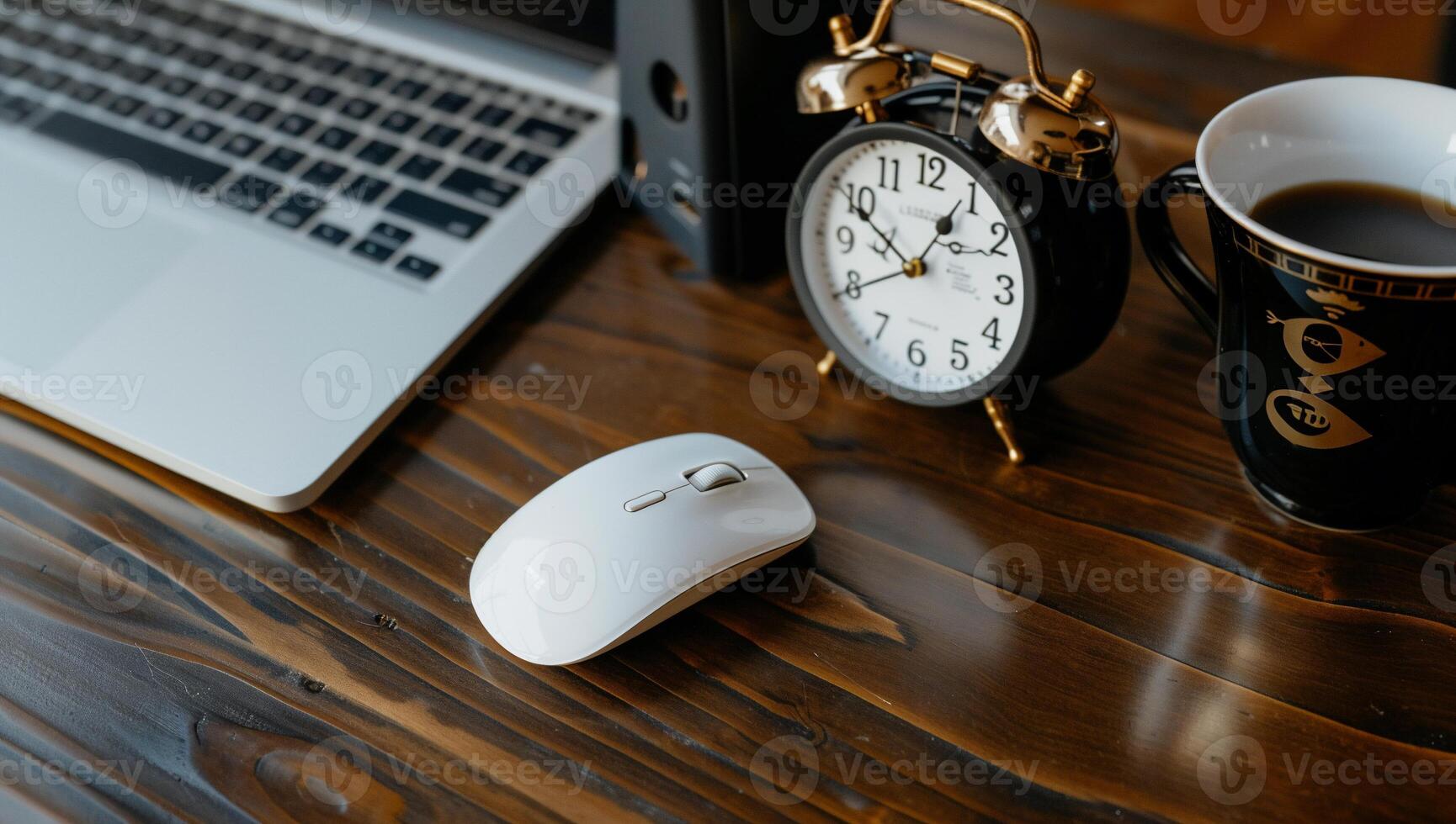 Modern workspace setup. Laptop, mouse, clock, coffee photo