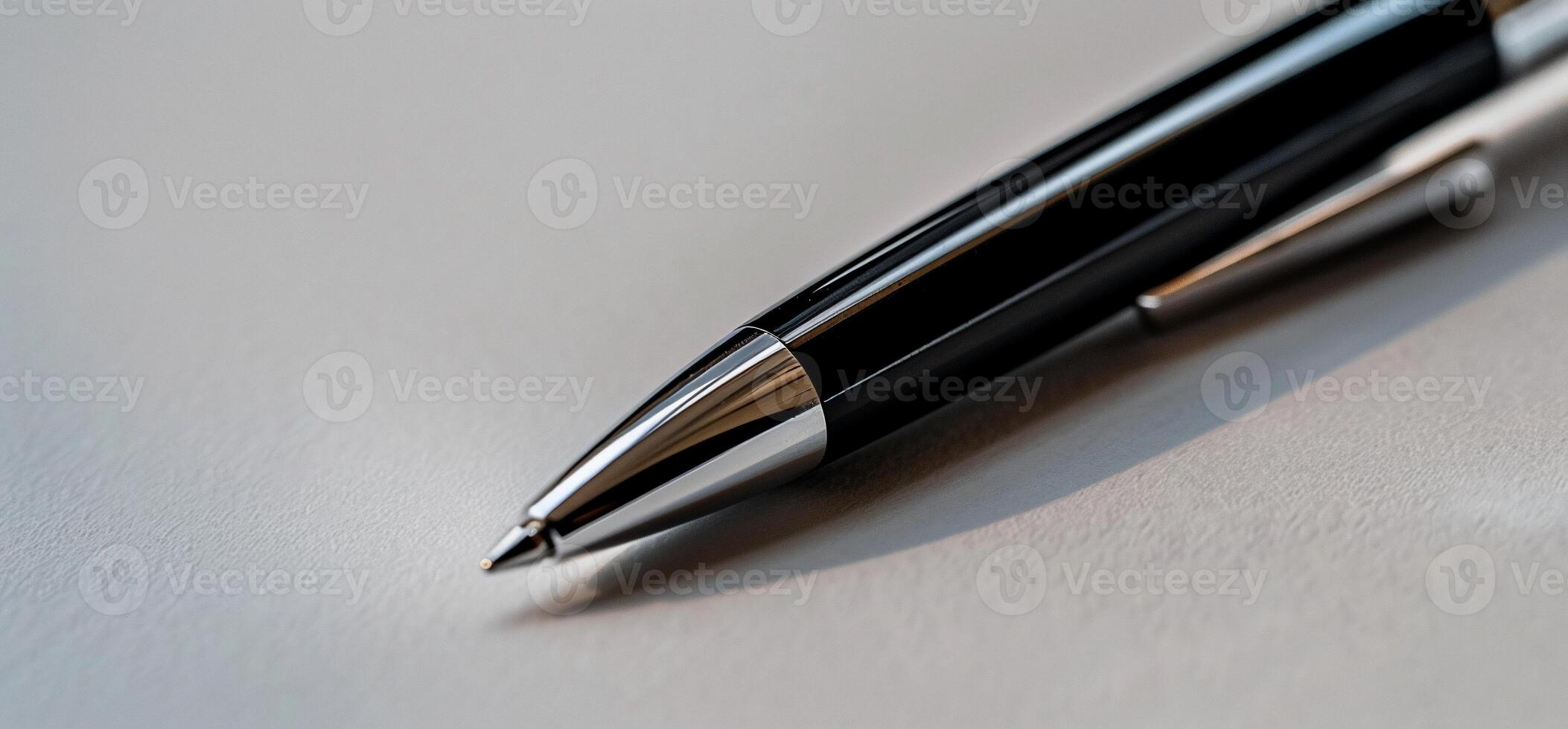 A close up of a pen on a table photo