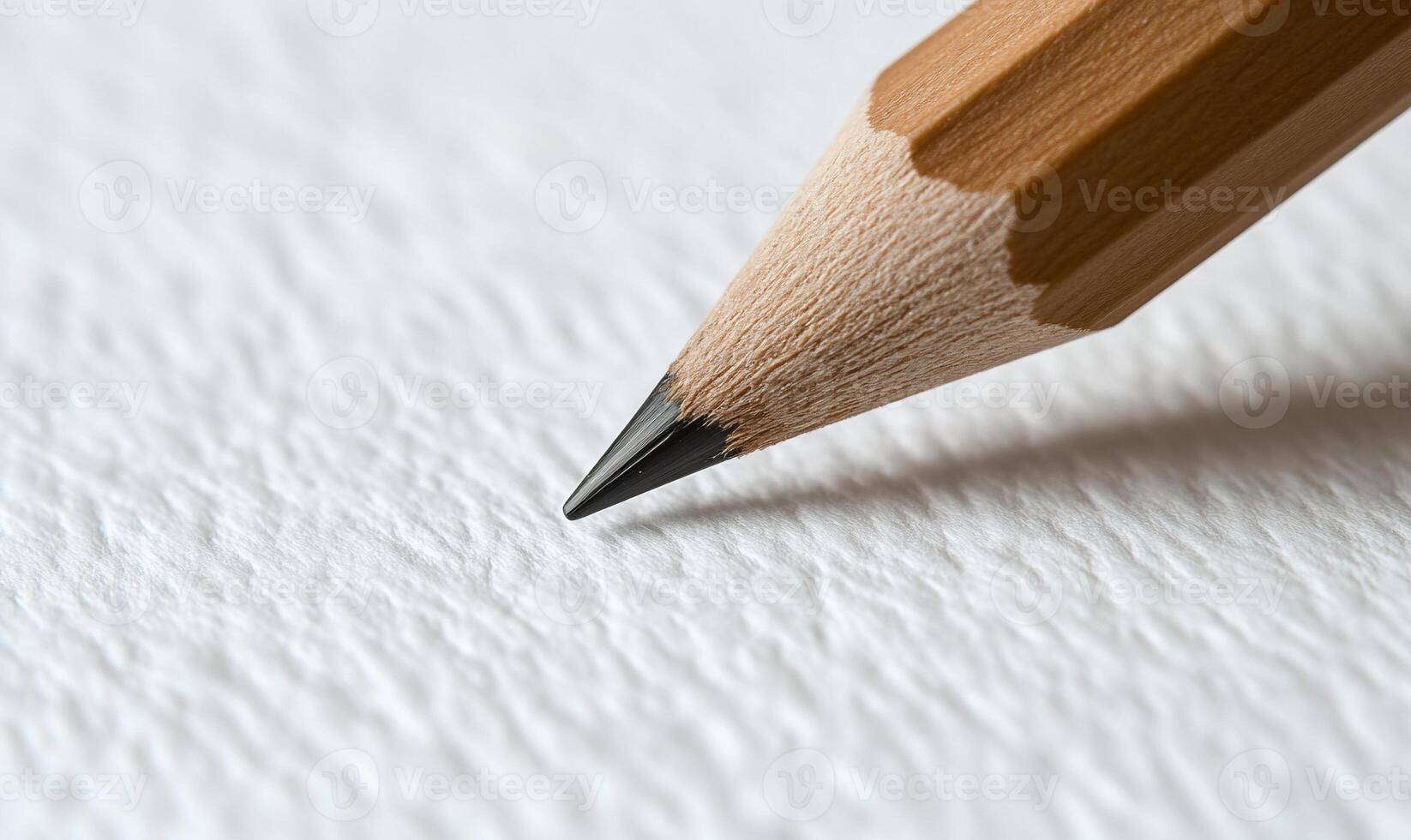Close-up of a pencil point on textured paper photo