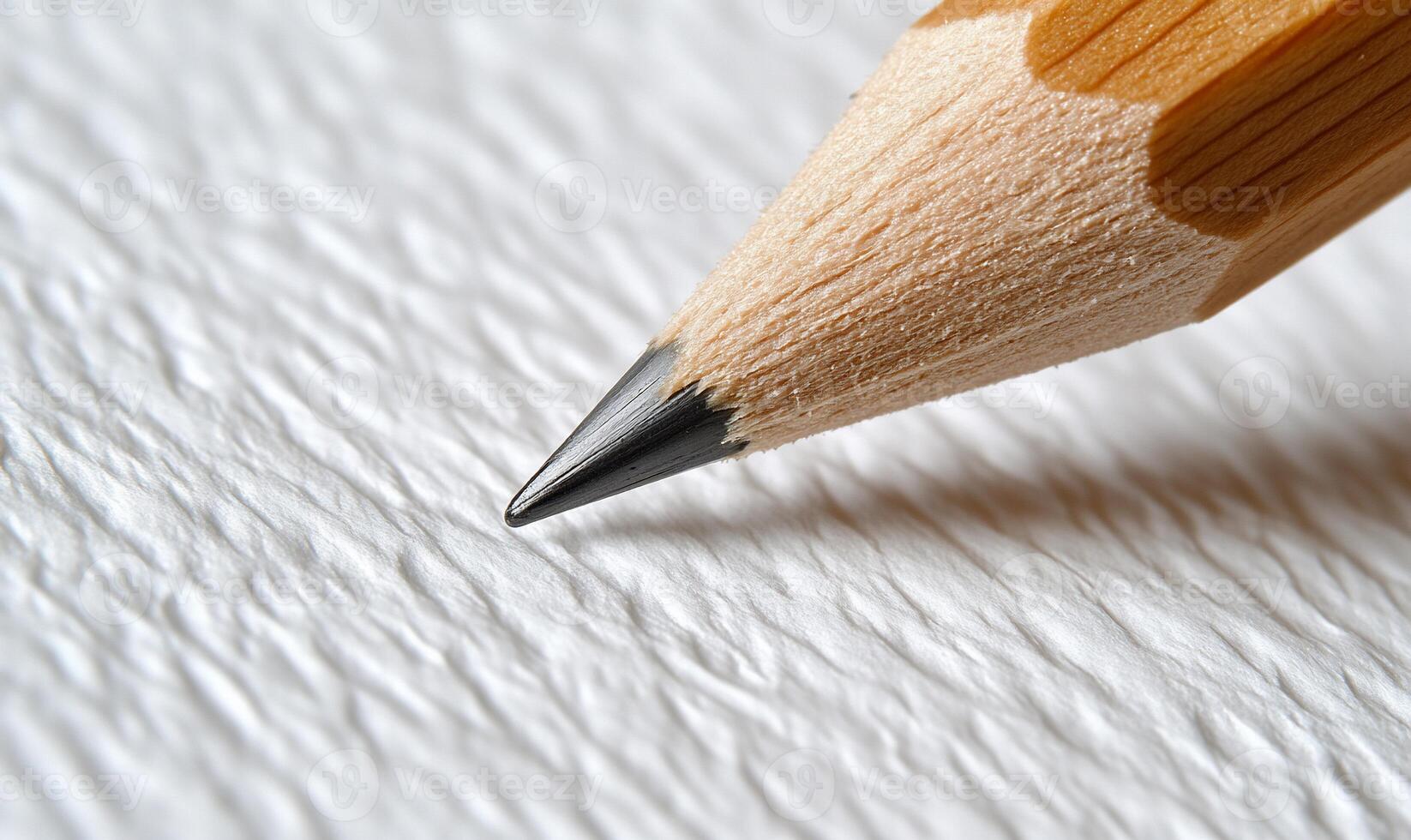 A close up of a pencil on a white surface photo