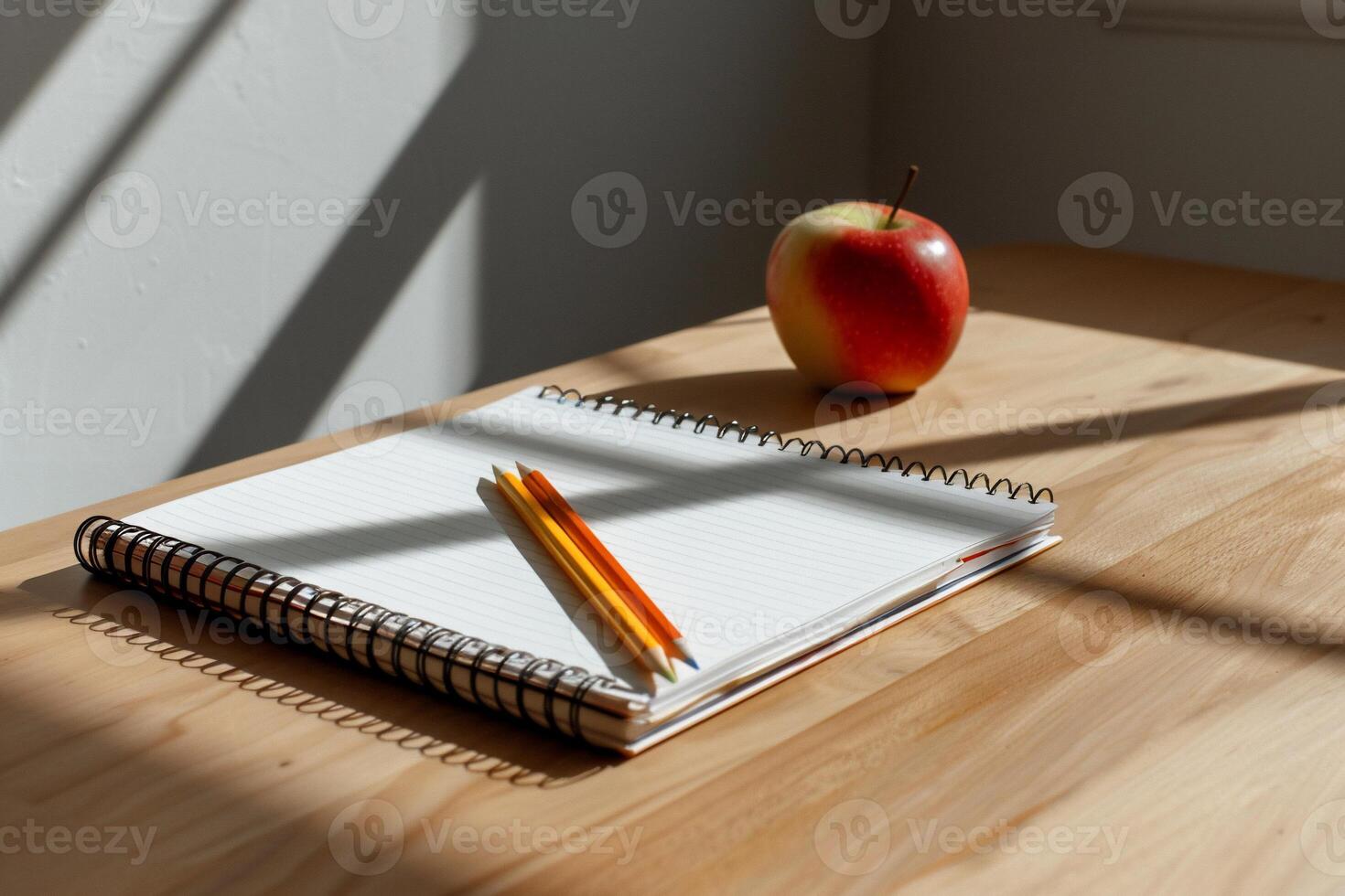 Simple study setup with apple and pencils photo