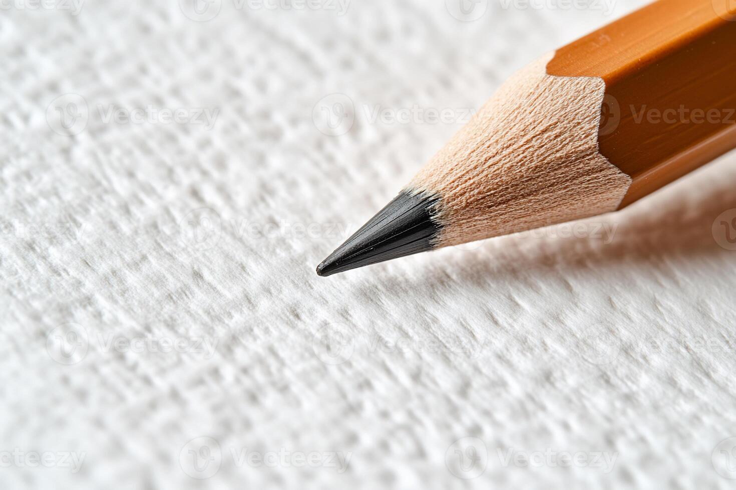 Close-up of a pencil tip on textured paper photo