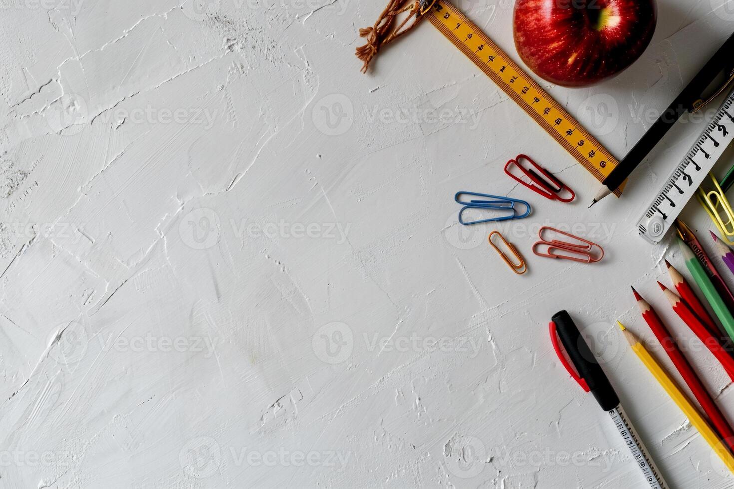School supplies arranged on a white surface photo
